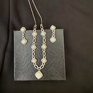 Necklace and matching pierced earrings. Lab created Opal. Diamond accent.